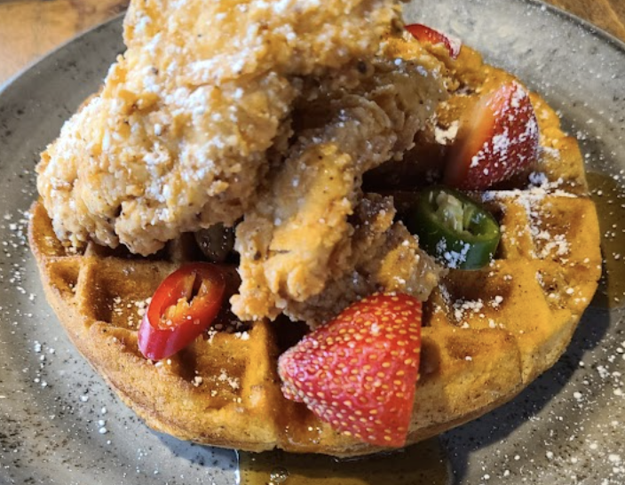 Lucille's signature dishes Chicken and WaffleOxtail PhillyOxtail Tamales